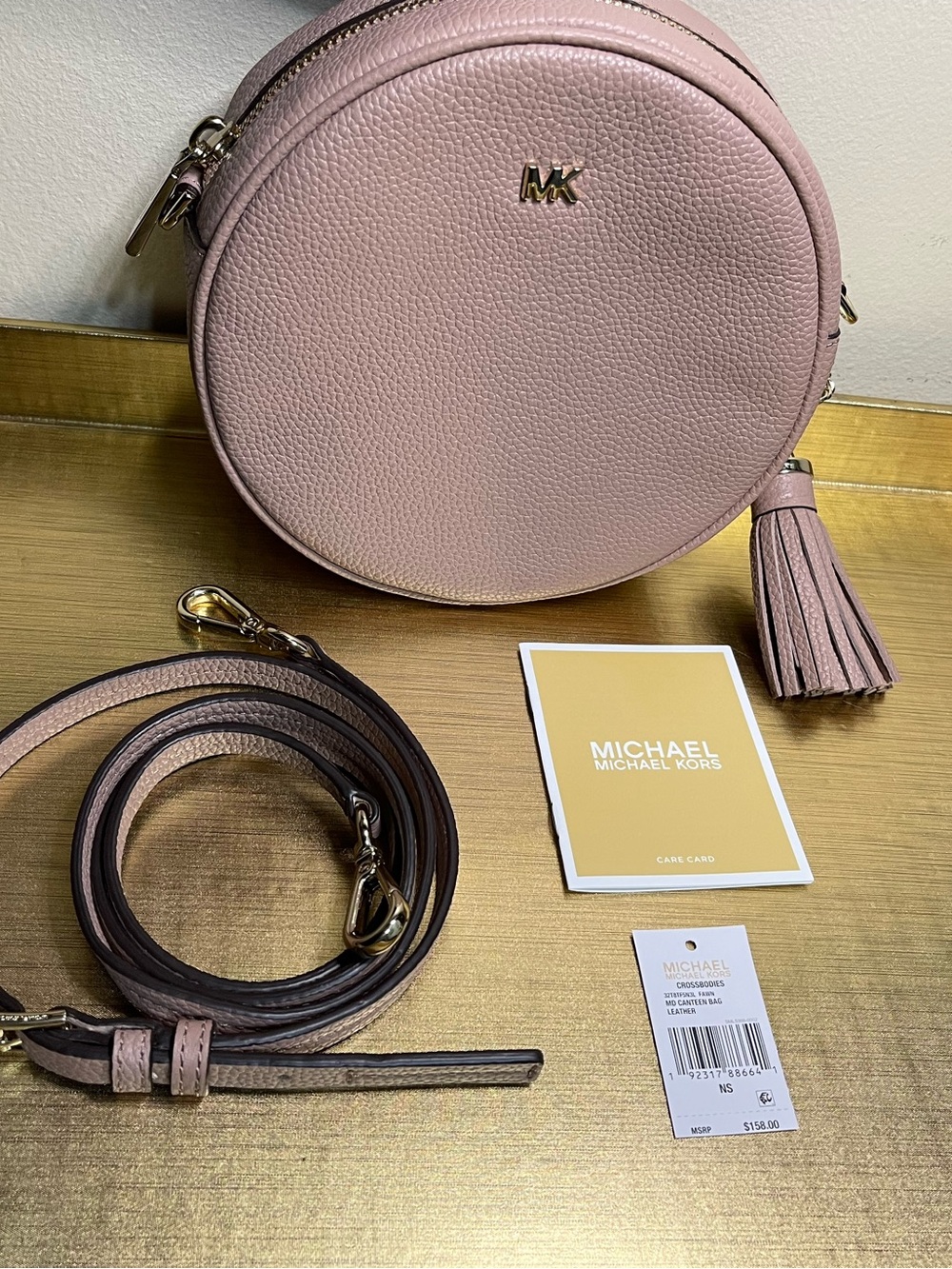 Michael Kors Blush Pebbled Leather Round Crossbody Bag with Tassel